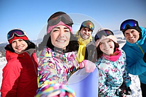 Group of friends taking selfie outdoors. Winter vacation