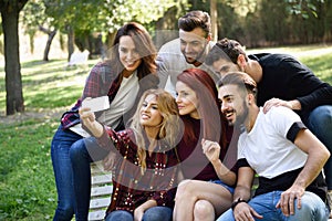 Group of friends taking selfie in urban background