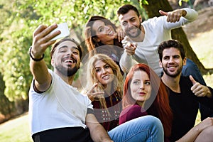 Group of friends taking selfie in urban background