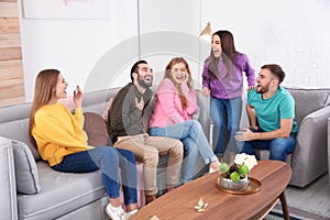 Group of friends telling jokes and laughing photo