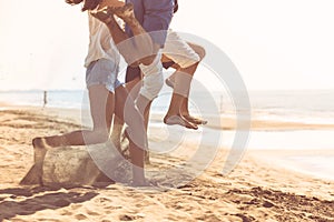 Group of friends together on the beach having fun.