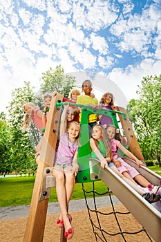 Group of friends together on a chute in summer photo