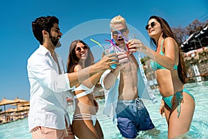 Group of friends together enjoying party, cocktails on summer vacation. People travel fun concept.