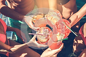 Group of friends together in the swimming pool leisure