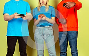 Group of friends using mobile smartphones. Teenagers addiction to new technology trends. Close up.