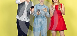 Group of friends using mobile smartphones. Teenagers addiction to new technology trends. Close up.