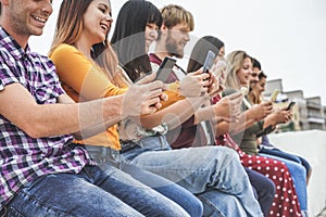 Group of friends using smart mobile phones app - Teenagers addiction to new technology trends - Concept of youth, tech, social and