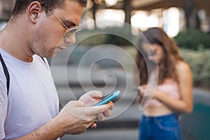 Group of friends using smartphones. Emotional isolation and technology depresion photo