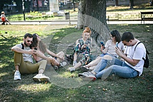 Group of friends using smartphones. Emotional isolation and technology depresion