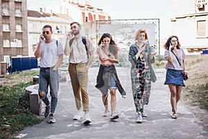 Group of friends using smartphones. Emotional isolation and technology depresion photo