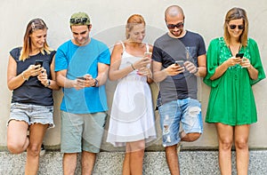 Group of  friends watching smart mobile phones - Millennials generation