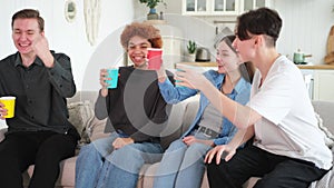 Group of friends watching sport match soccer football game on tv. Happy football fans celebrating victory at home