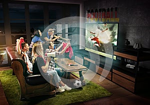 Group of friends watching TV, football match in Germany, sport games