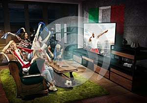 Group of friends watching TV, football match in Italy, sport games
