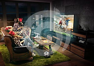 Group of friends watching TV, football match, sport together