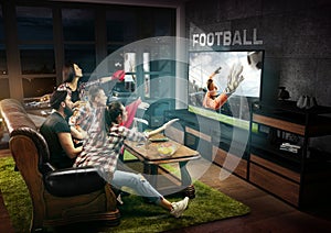 Group of friends watching TV, sport concept, leisure activity