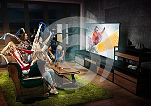 Group of friends watching TV, sport concept, leisure activity