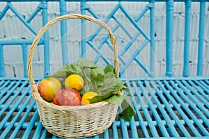 Group of fruits and green leaves in the basket