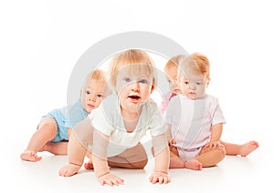 Group of funny babies sitting on white background, isolated