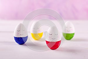 Group of funny colorful eggs - a concept of merry Easter, funny characters, emotions.