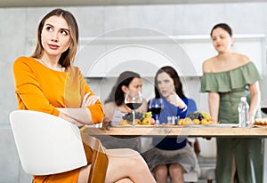 Group of girlfriends at party scold their friend. Quarrel at bachelorette party