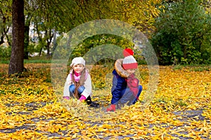 Group of girls in autumn park on the brench