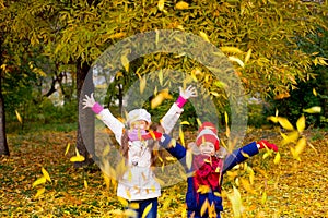 Group of girls in autumn park on the brench