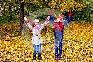 Group of girls in autumn park on the brench