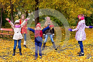 Group of girls in autumn park on the brench