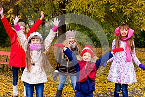 Group of girls in autumn park on the brench