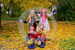 Group of girls in autumn park on the brench