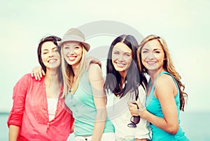 Group of girls chilling on the beach