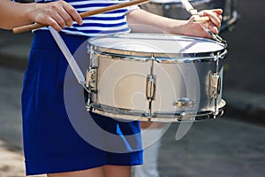 Group of girls drummers. parade on a city street