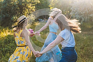 Group of girls friends making picnic outdoor