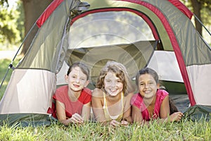 Group Of Girls Having Fun In Tent In Countryside