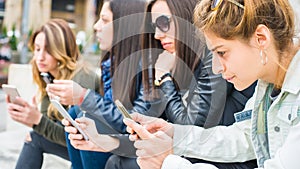 Group of girls with smartphones. Technology isolation and emotional depresion