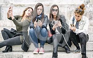 Group of girls with smartphones. Technology isolation and emotional depresion