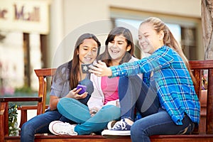 Group Of Girls Taking Selfie On Mobile Phone