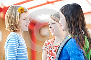 Group Of Girls Talking Outside School Building