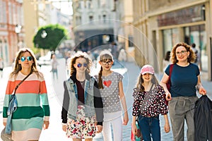 Group of girls walking through downtown - shopping trip