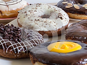 Group of glazed donuts on wooden background