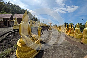 The Group of golden Buddha statues of Phu Salao temple in the Pakse city, Champasak Province, Southern Laos