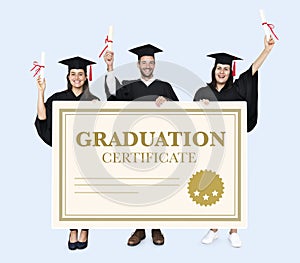 Group of grads in cap and gown with graduation certificate