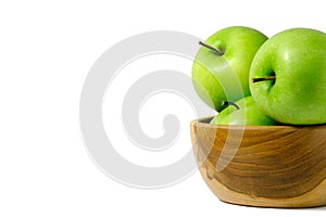 Group of green Apple granny smith above wooden bowl / basket isolated on white background