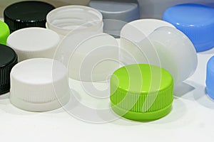 The group of green and white plastic drinking water caps