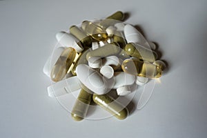 Group of green, white and yellow pills