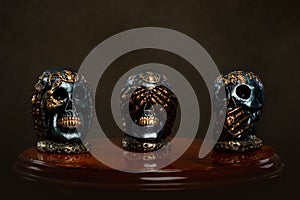 Group of hand painted plaster skulls