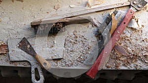 Group of hand tools among construction debris
