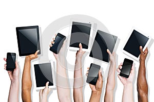 Group of Hands Holding Digital Devices photo