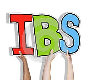 Group of Hands Holding IBS Letter photo